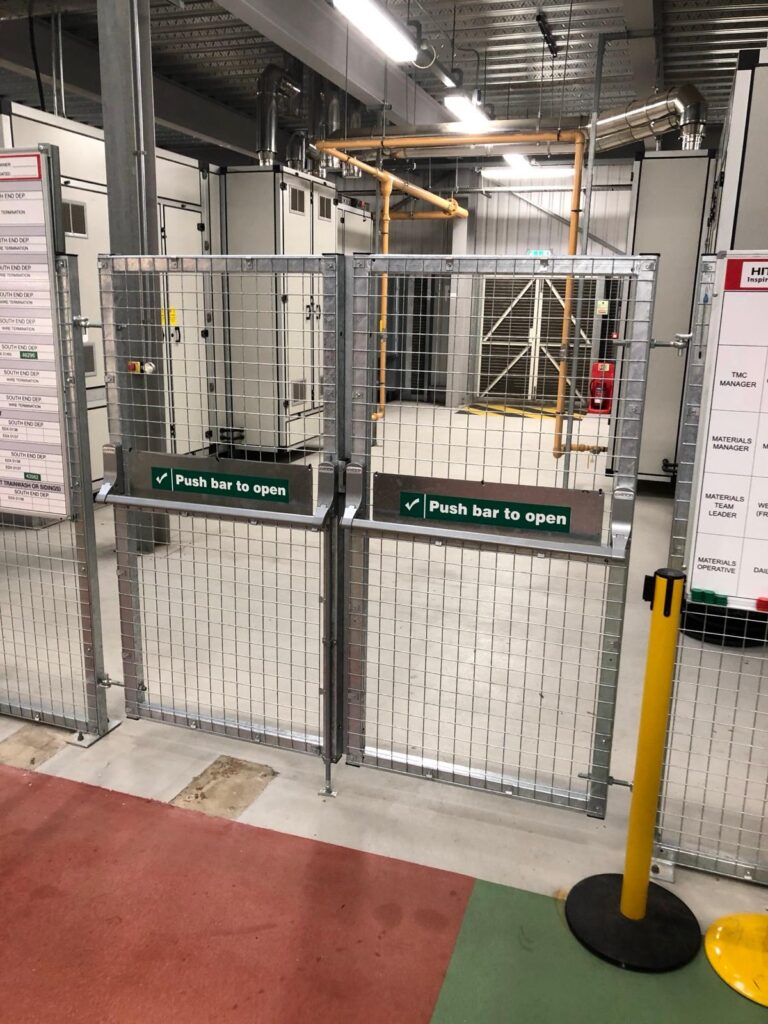 industrial-facility-security-gate-with-push-bars.jpg A bespoke industrial facility gate with push bars for easy access